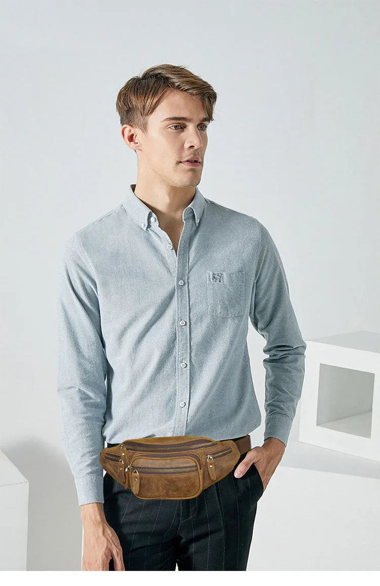 Retro brown leather messenger bag with a single shoulder strap shown open.
