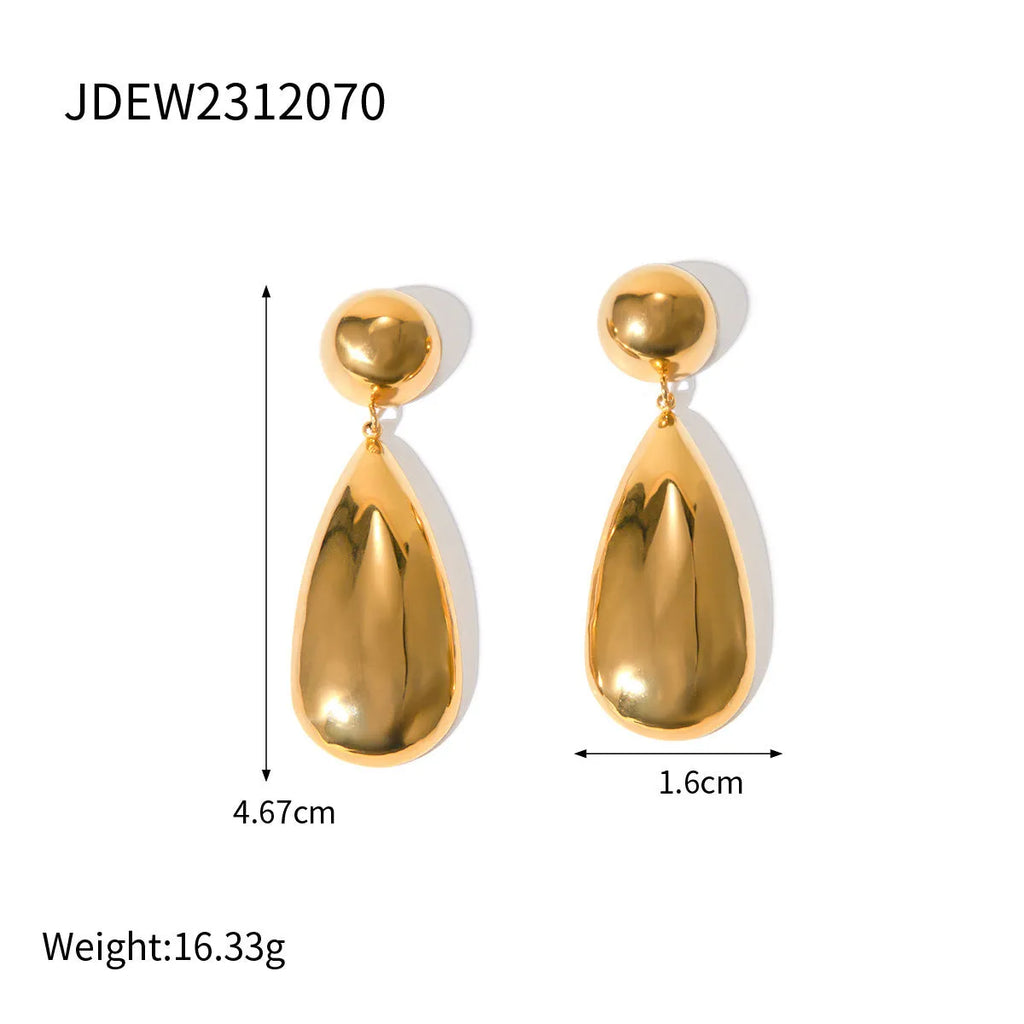 A pair of gold-coloured stainless steel earrings featuring geometric hemisphere shapes forming a water droplet design.