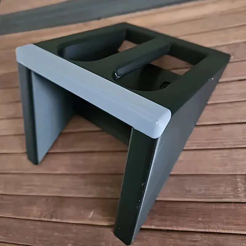 Black punk-style plastic pistol stand measuring 10.85 by 7.6 centimetres