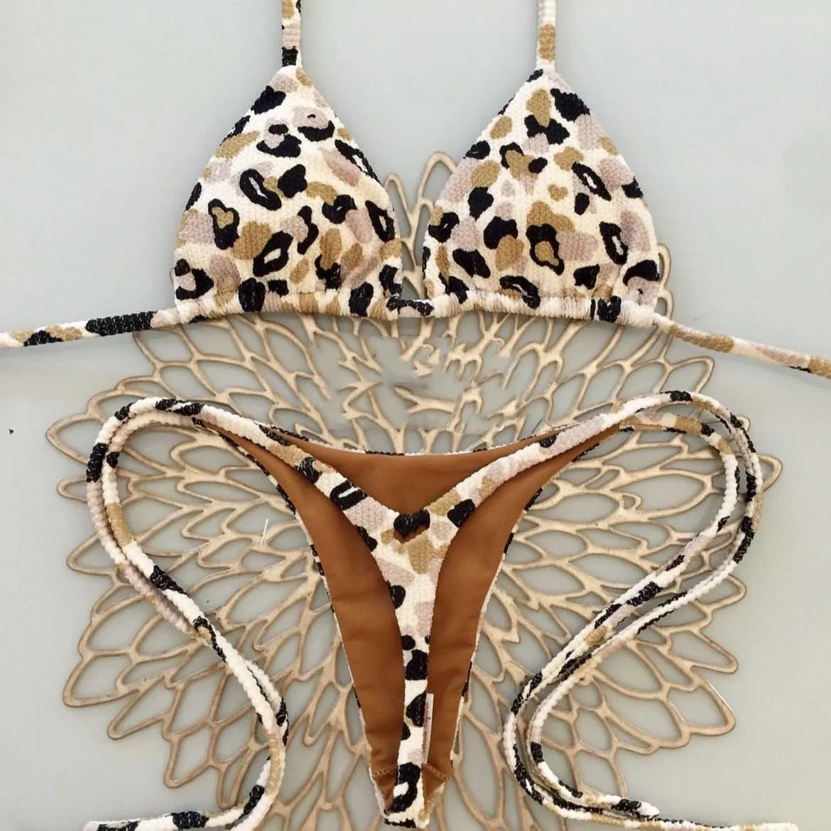 Women's printed bikini swimsuit with cotton lining on mannequin showing briefs style