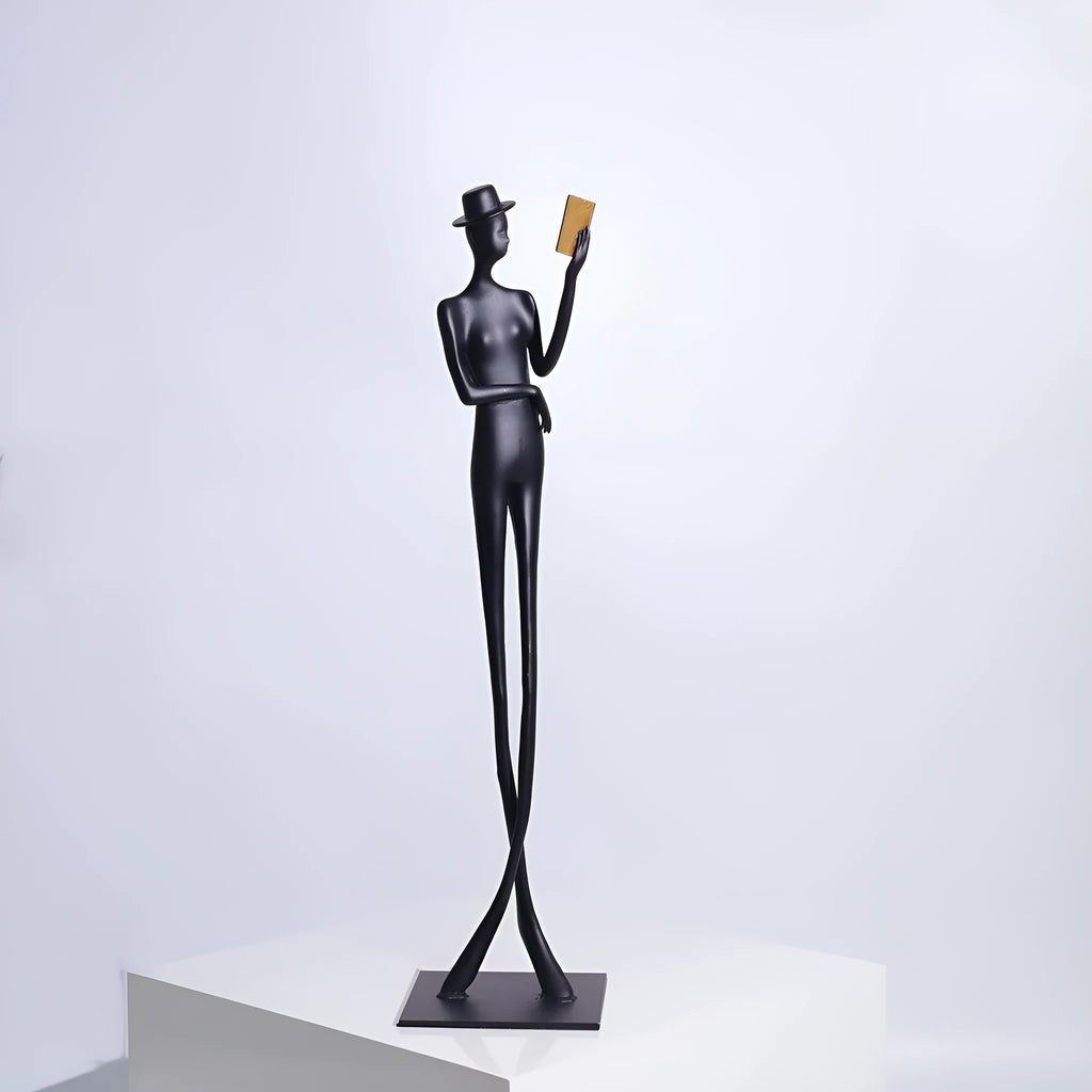 Black aluminium desktop sculpture of woman reading in modern style