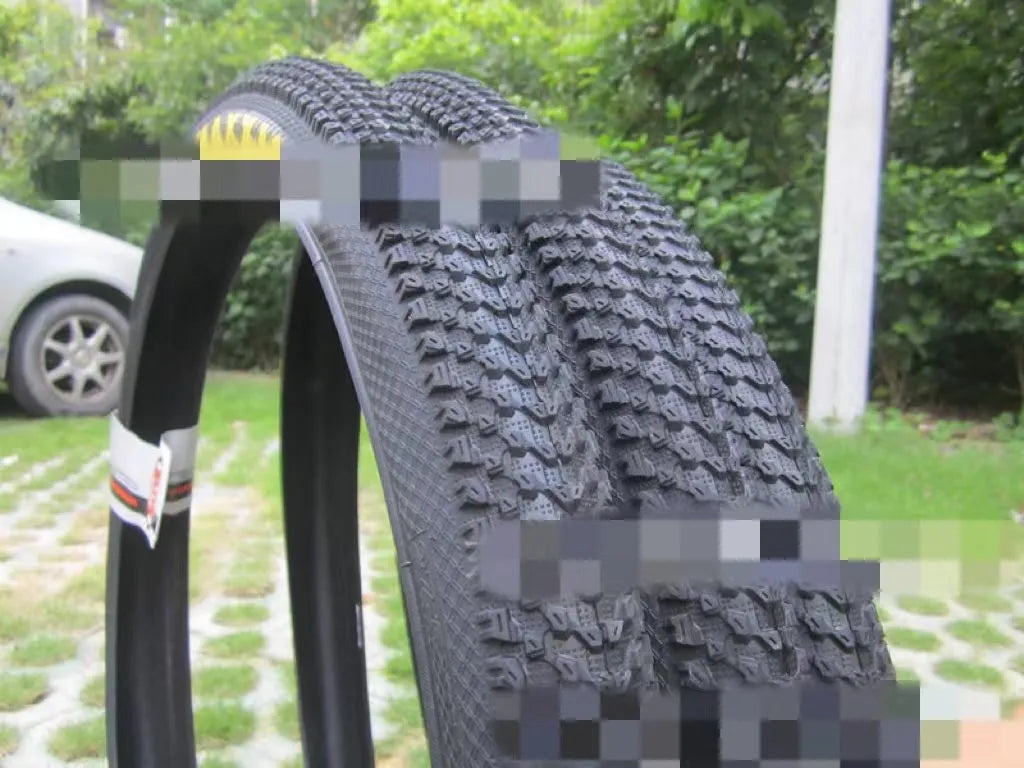 Ultralight puncture-resistant mountain bike tyre showing tread pattern, available in multiple wheel sizes.