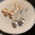 Metal heart-shaped geometric earrings with electroplated silver needle finish, three colour ball options
