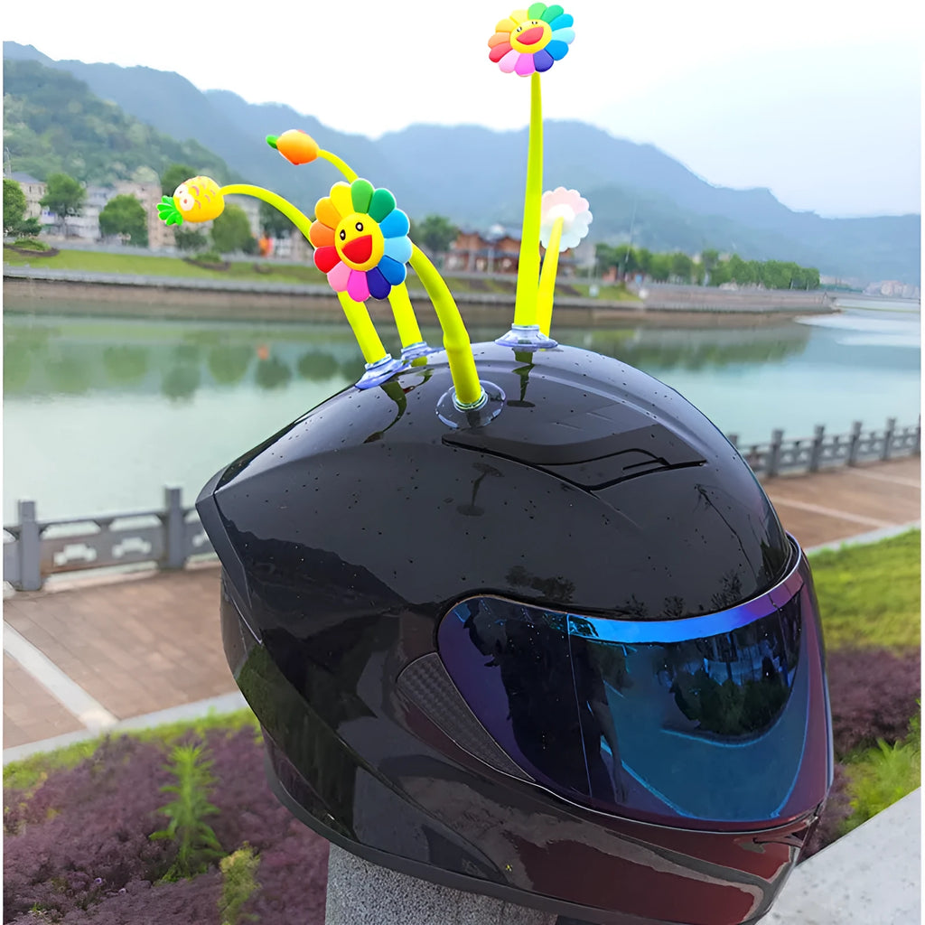Yellow silicone sunflower decoration with suction cup for helmet customisation.