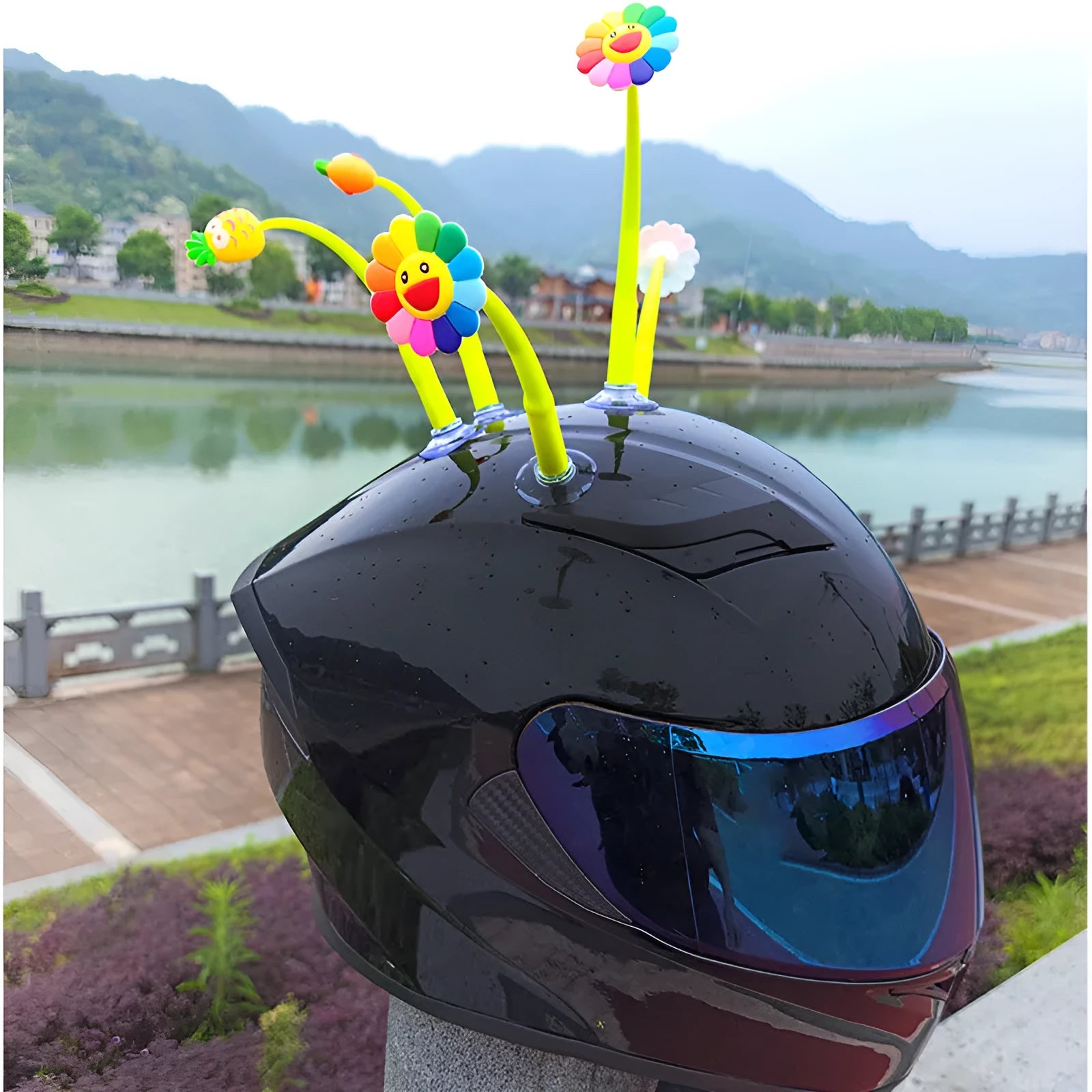 Yellow silicone sunflower decoration with suction cup for helmet customisation.