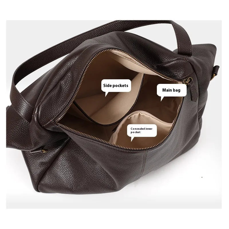 Brown genuine leather women's shoulder bag with horizontal square shape showing interior zipper compartment