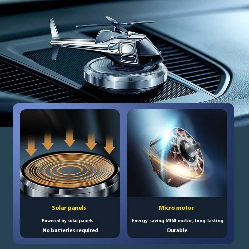 Silver metal solar helicopter car perfume ornament with rotating blades on dashboard