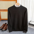 Men's half-collar wool sweater in loose fit showing colour options including black, brown and camel