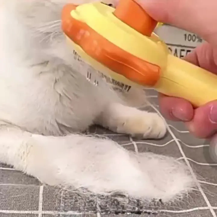 Stainless steel pet comb with one-click hair removal in blue, pink, and yellow colours on white background