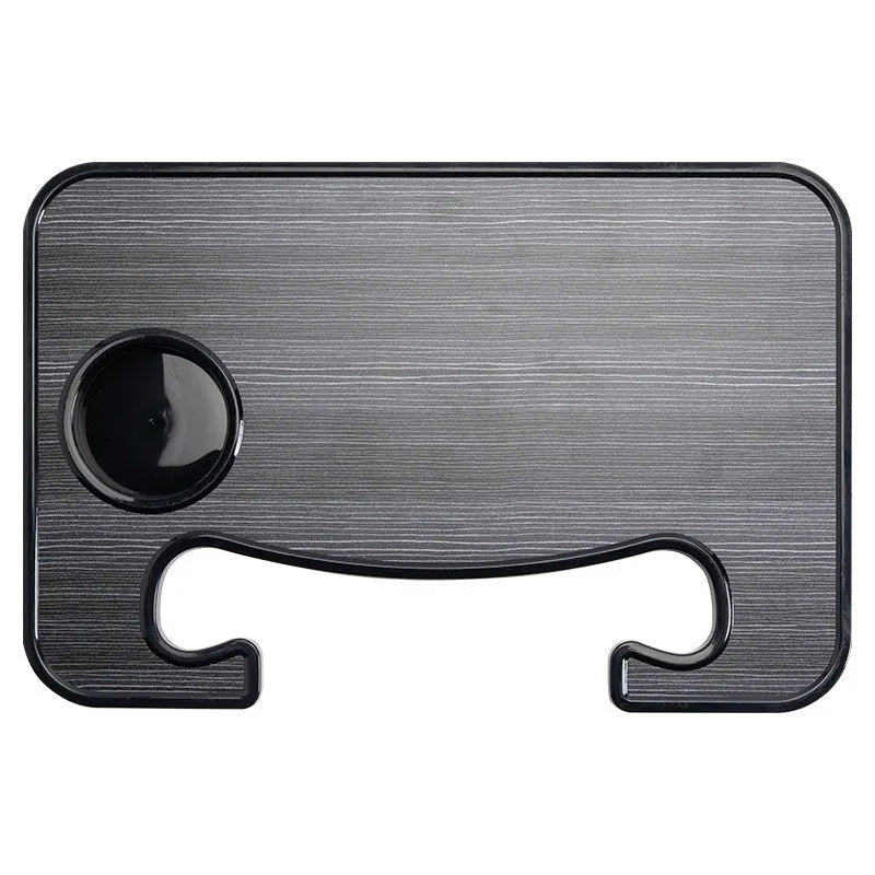 Black ABS car steering wheel laptop stand with foldable drink holder mounted in vehicle