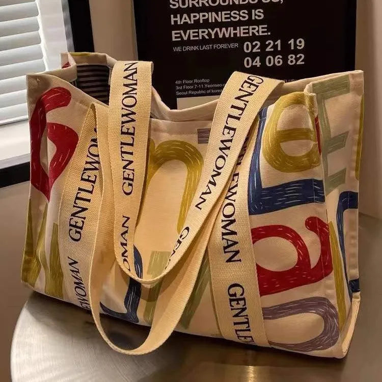 Large canvas women's tote bag with printing, shown in different colour and pattern style options.