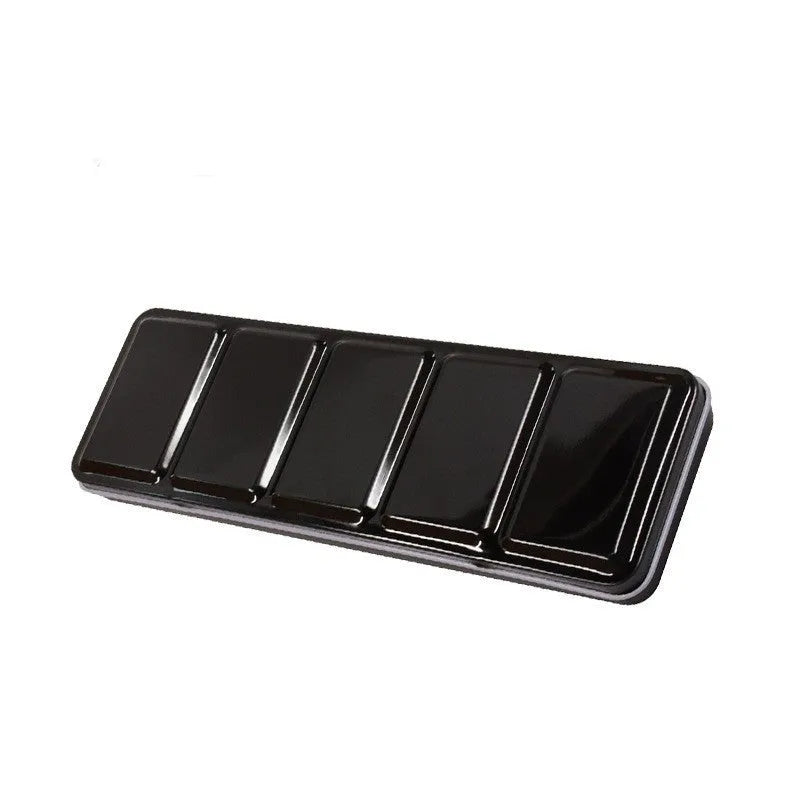Tinplate metal folding watercolour paint box with colourful printed design, shown open to reveal compartments for solid paint pans.