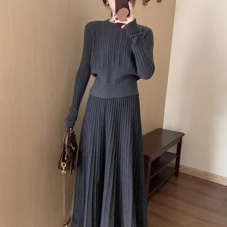 Dark grey knitted long dress suit with 3D pattern and collage stitching, shown with matching skirt.