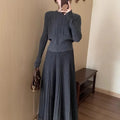 Dark grey knitted long dress suit with 3D pattern and collage stitching, shown with matching skirt.