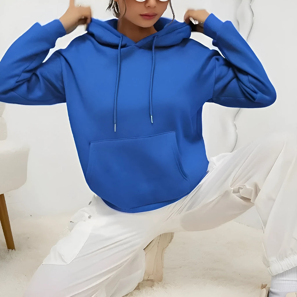 Women's loose grey drawstring pocket sweatshirt with long sleeves and a front pouch.