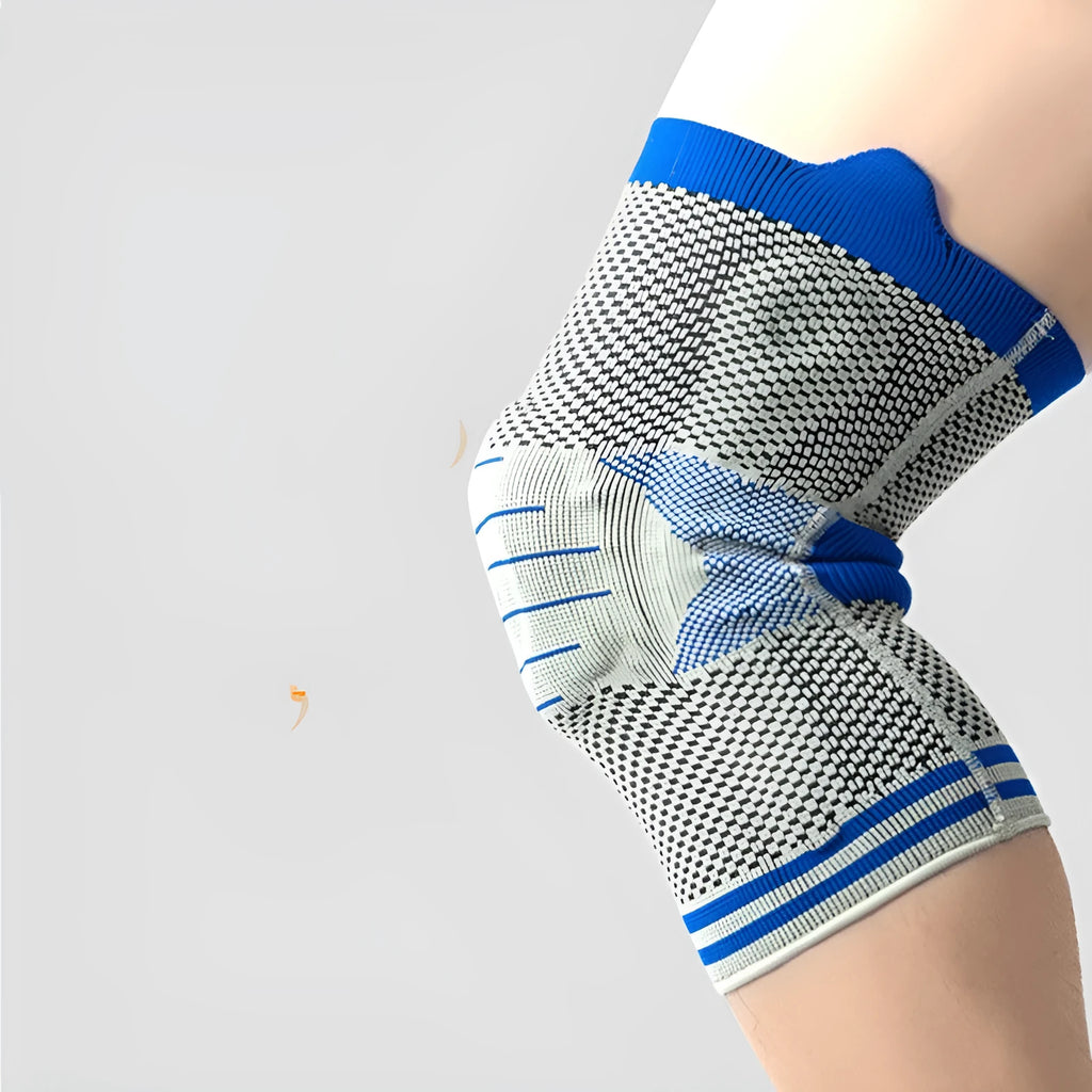 Black and gray knee pad with silicone shock absorber for sports protection on a leg.