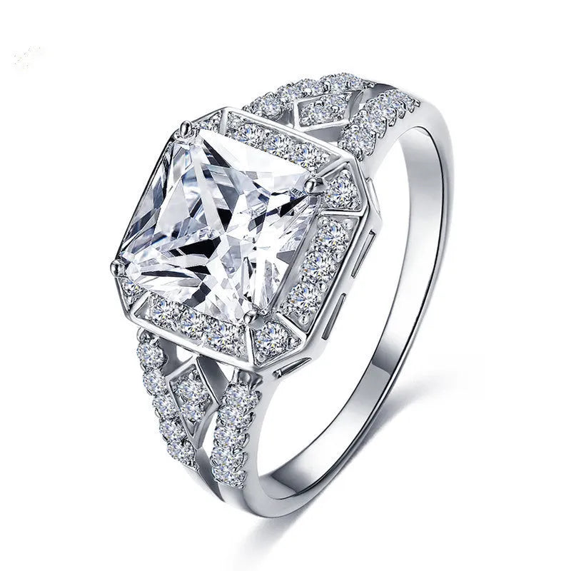 Women's geometric zircon ring with hollow design and quadrilateral shape in platinum colour.