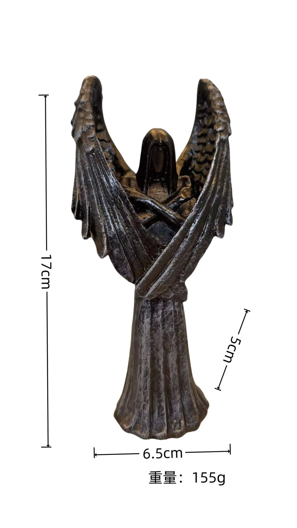 Small dark angel resin statue ornament on a table, showing detailed wings and robe.