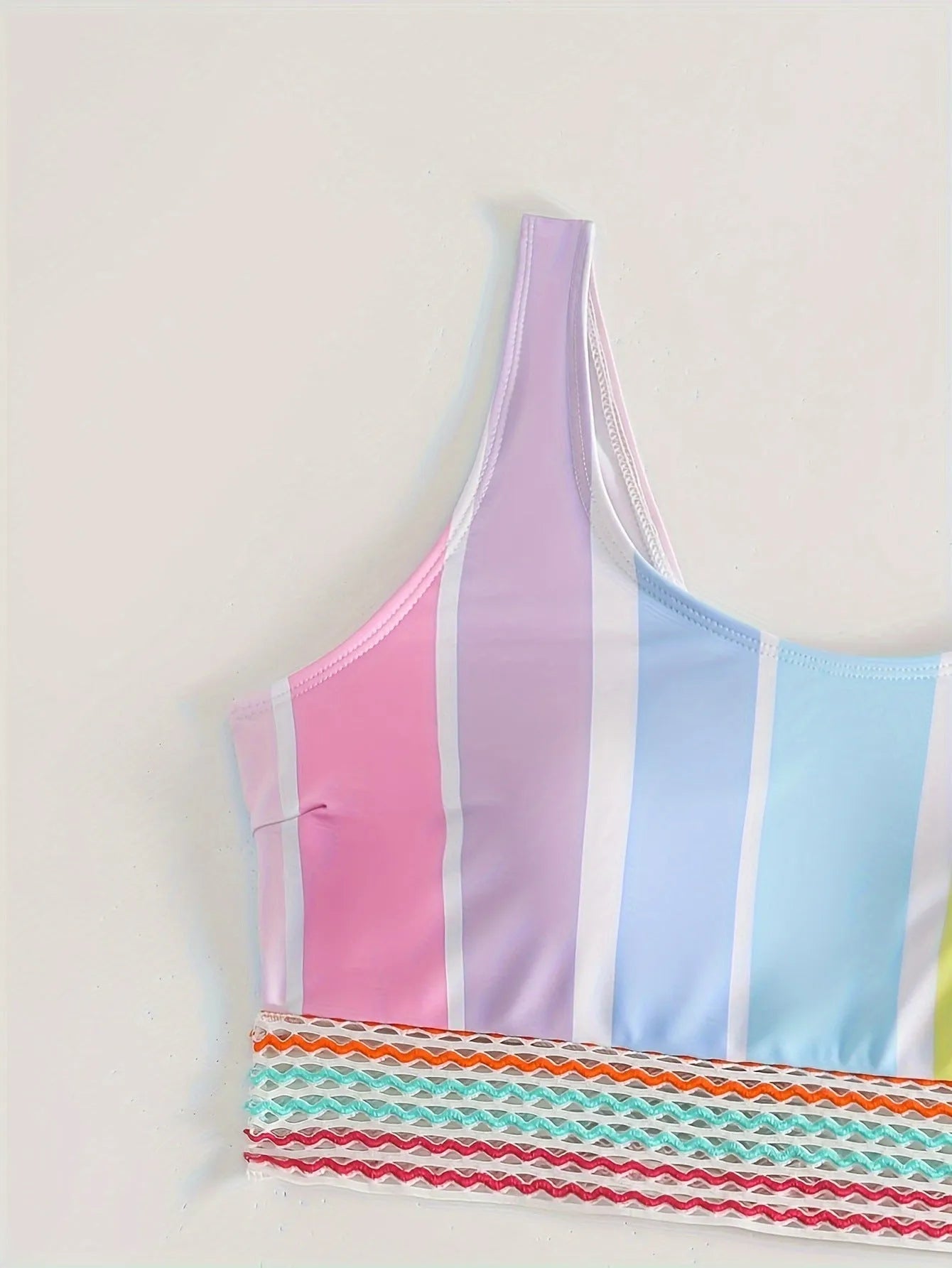 Women's striped sport bikini top and briefs on a white background.