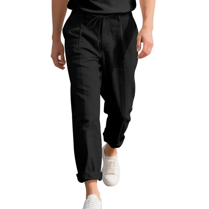 Men's light khaki linen casual trousers with a drawstring waistband and straight-leg silhouette.