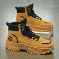 Men's black and yellow Martin work boots showing mid-calf height and stout heel.