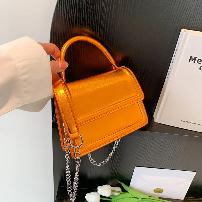 Retro square-shaped PU crossbody bag in a choice of six colours on a model.