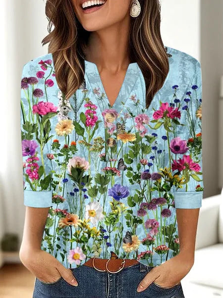 Women's loose fit V-neck t-shirt with a colourful 3D effect printed pattern on the front.