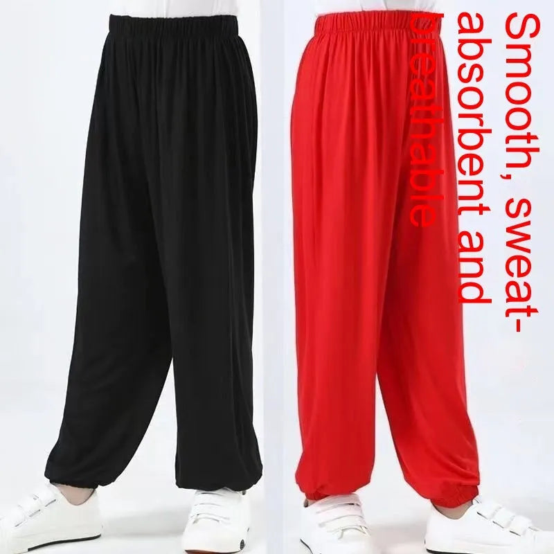 Black children's high-elasticity Sanda practice pants made from Lycra fabric, laid flat.