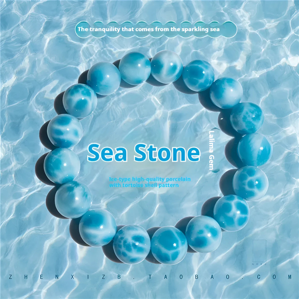 Unisex blue pearl and natural crystal sea-pattern stone bodhi bracelet on a wrist, showing Maillard style design.