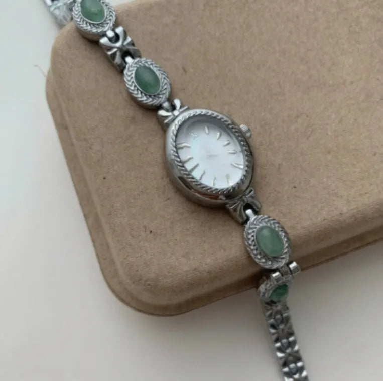 Green jade ladies quartz watch with silver case and white face