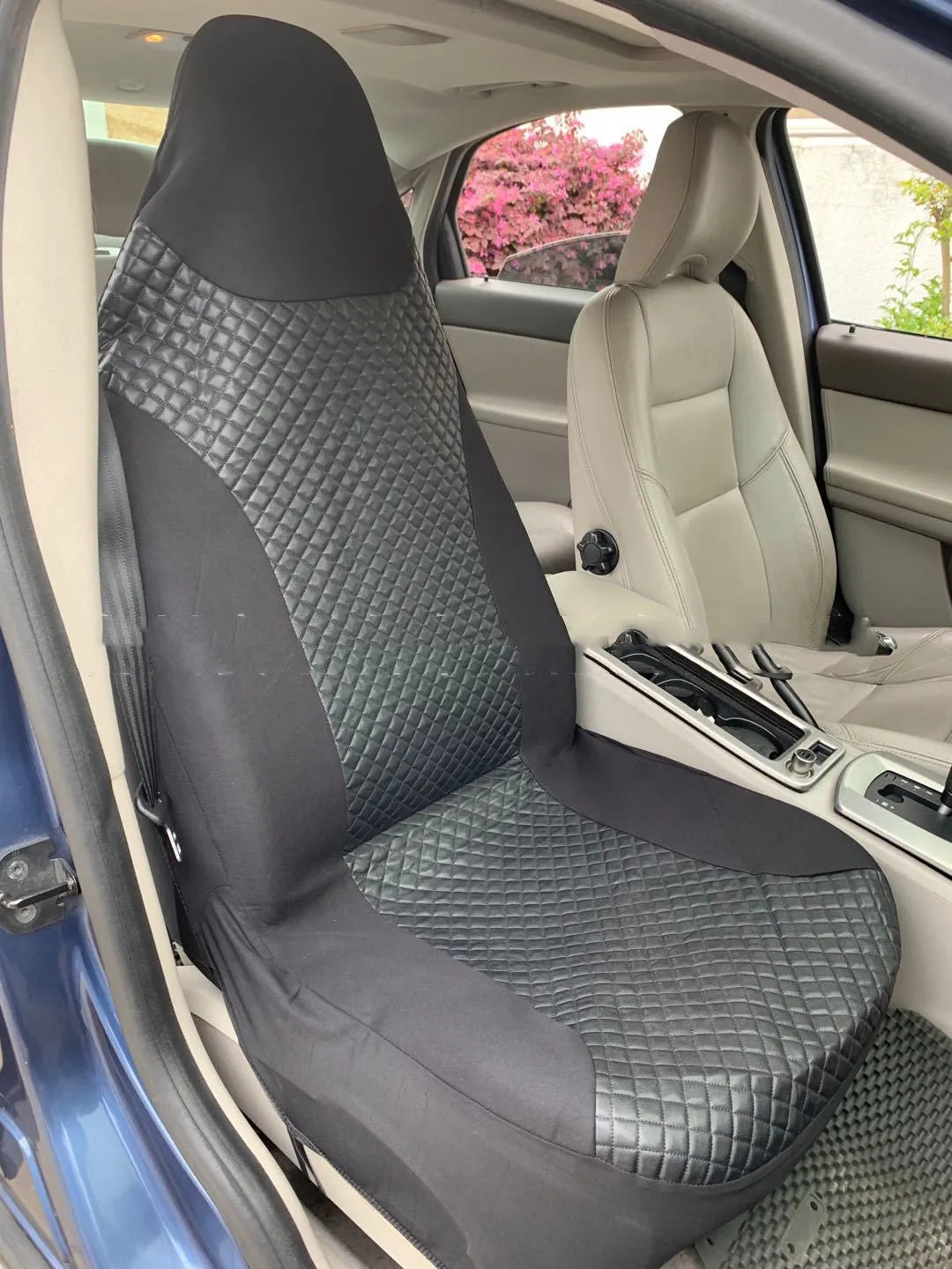 Black quilted universal car seat cover made from PU and polyester fabric.
