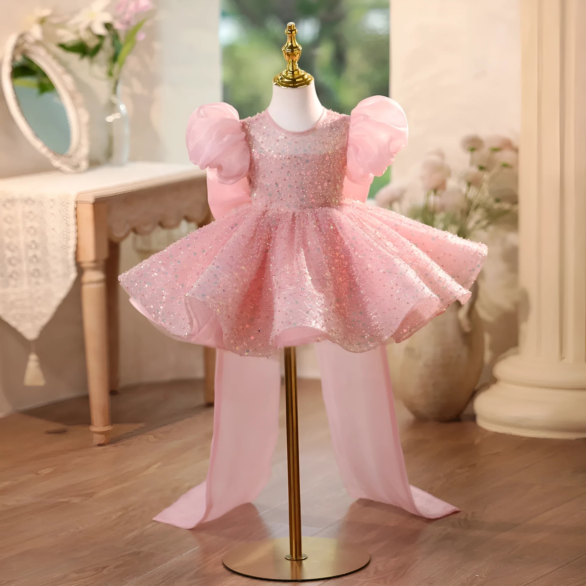 Children's sequined formal dress in pink with puff sleeves and princess-style silhouette for weddings and parties