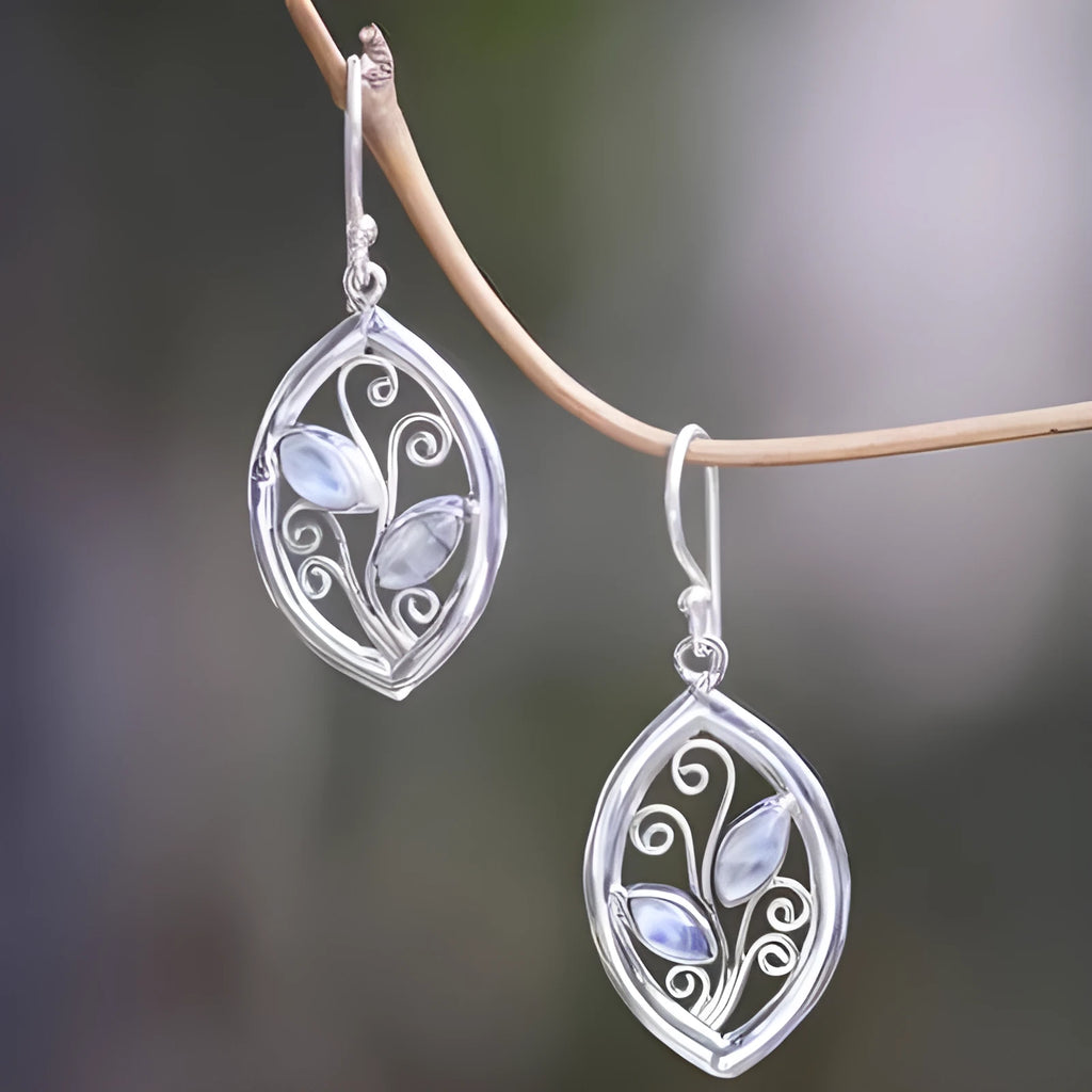 Silver colour women's earrings with leaves design and embedded colourful moonstones