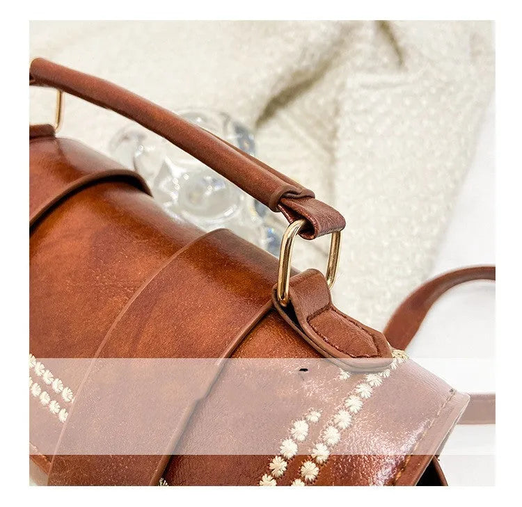 Versatile fashion portable messenger bag in black PU with three-dimensional pocket, square shape