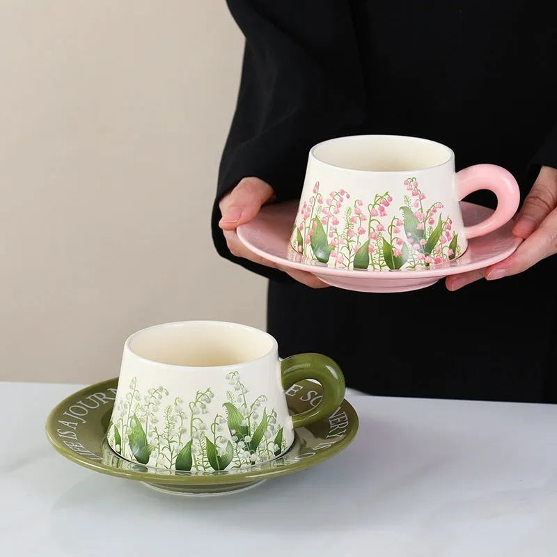 Ceramic coffee cup and saucer set for two people in Campanula design, with two mugs, two saucers, and two spoons.