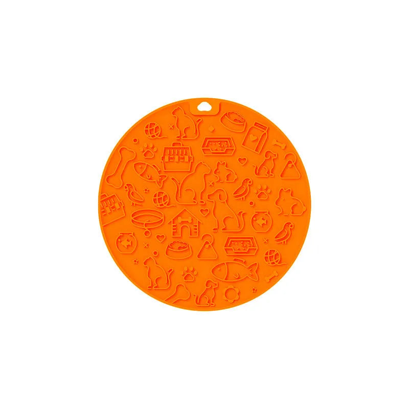 Round silicone pet licking mat with suction cup base in blue colour on kitchen floor