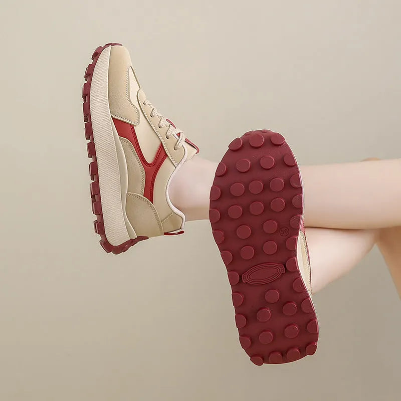 Women's solid colour platform sports shoes with lace-up front and flat rubber sole.