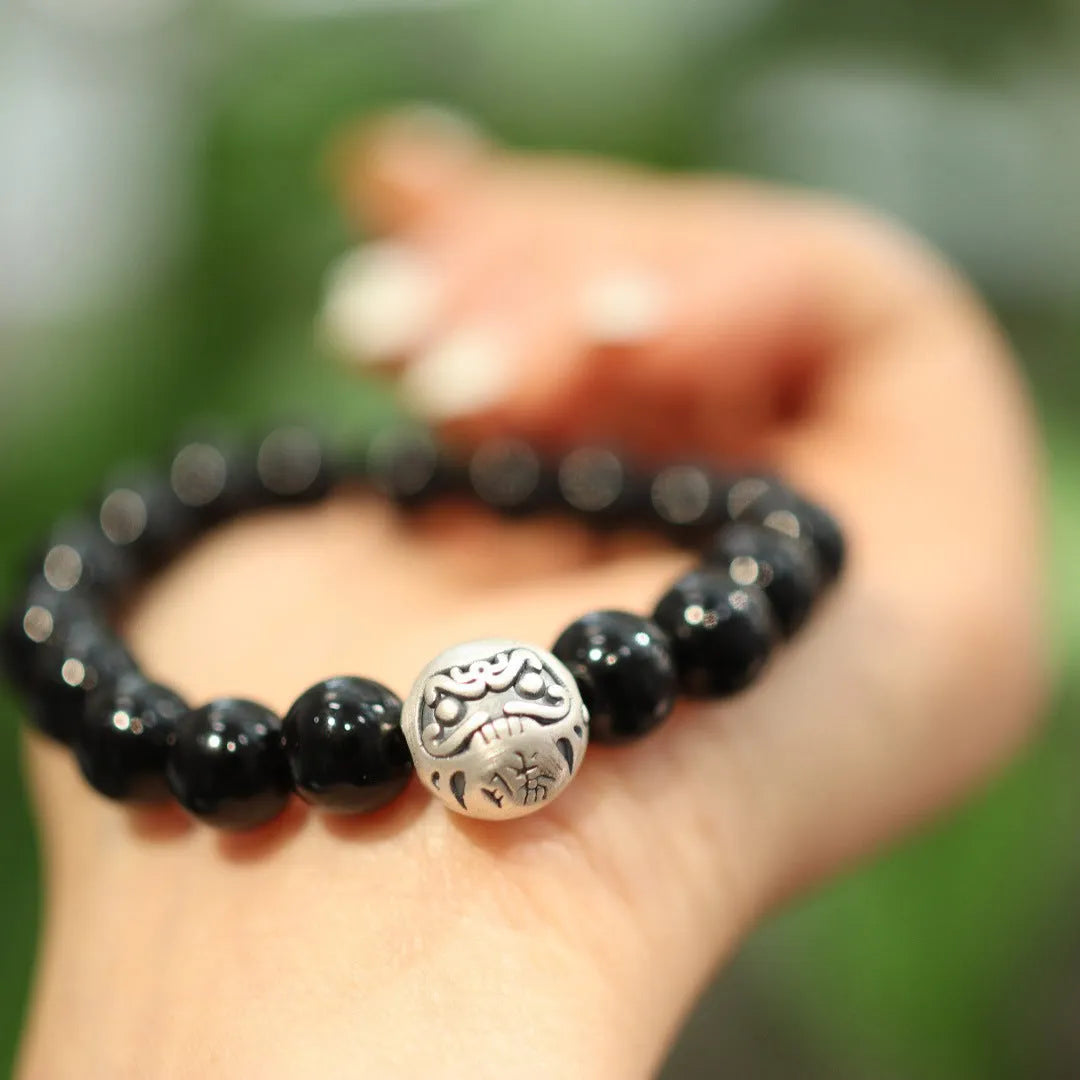 Black agate bracelet with 10mm beads, sterling silver components, and Chinese style design