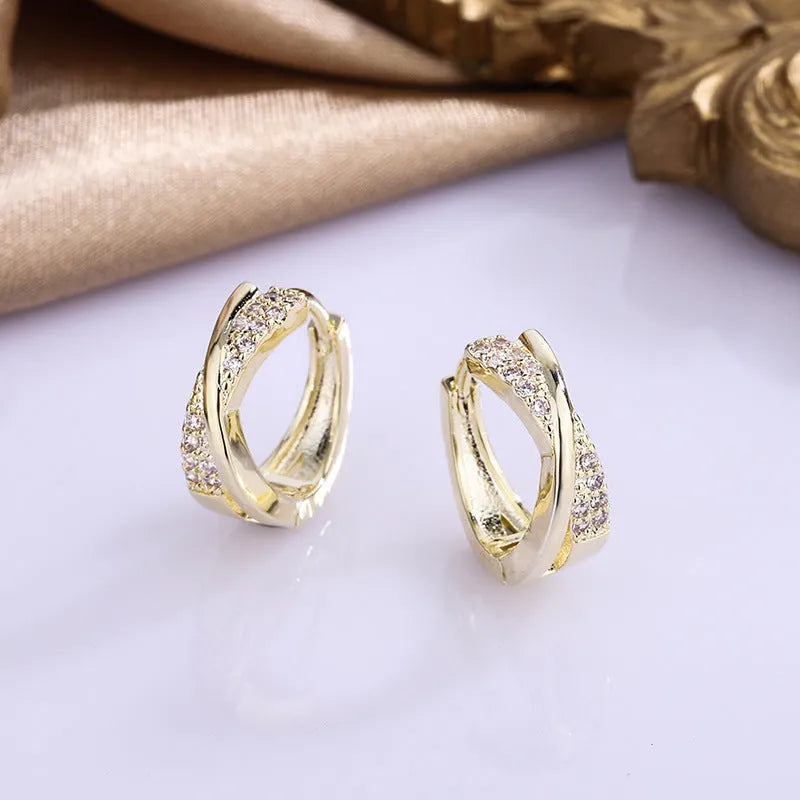 Geometric copper stud earrings with zircon detailing in 14K yellow gold colour