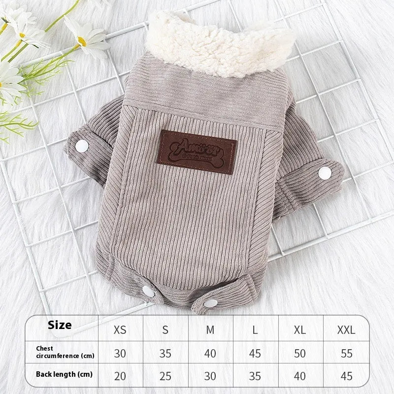 A grey lambswool fleece-lined vest for dogs on a hanger, showing its soft lining and size label.