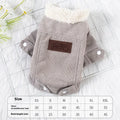 A grey lambswool fleece-lined vest for dogs on a hanger, showing its soft lining and size label.