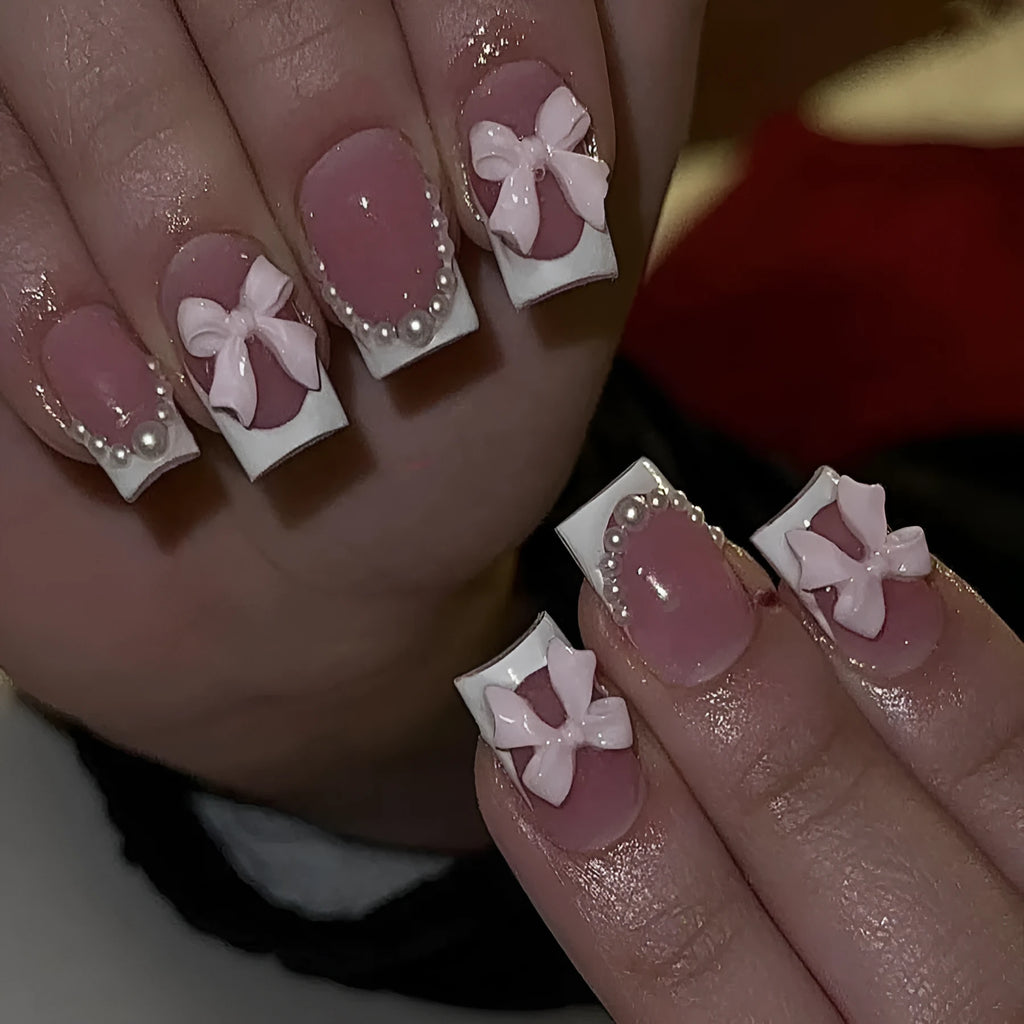 Artificial French manicure nail set with bow decorations and multiple patterns