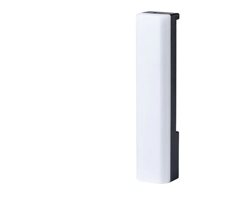 Black and white 3D RGB music rhythm ambiance lamp on a table with USB cable.