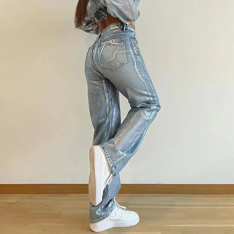 Washed blue high-waist straight-leg jeans with hot silver contrast stitching on a mannequin