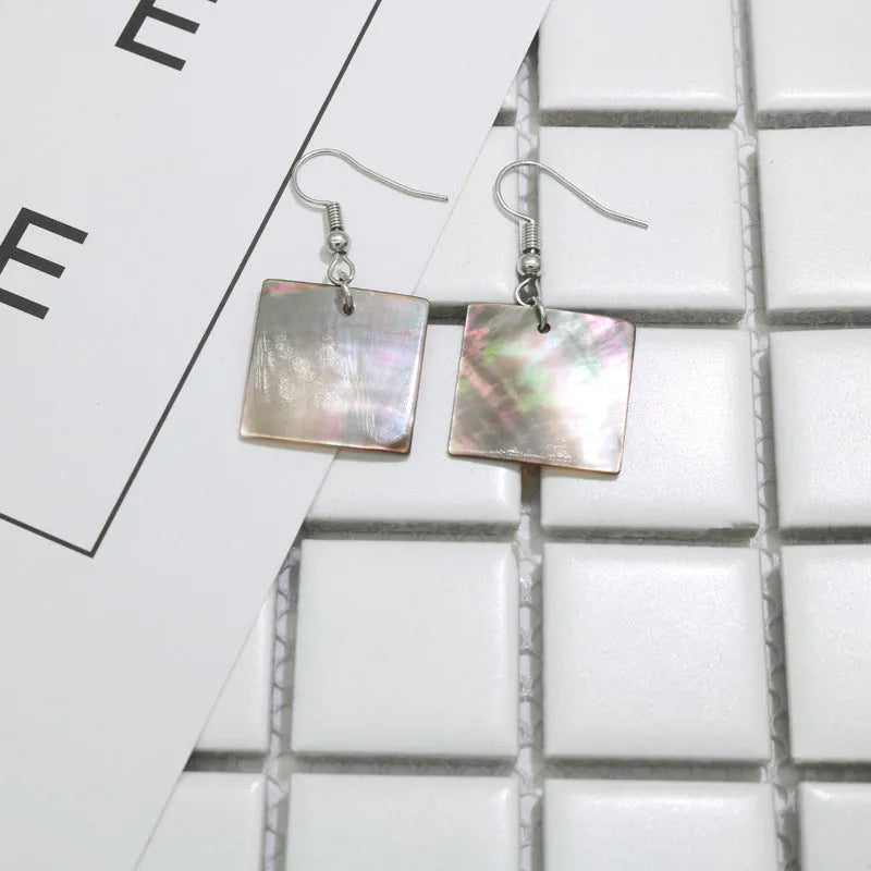 Women's geometric shell earrings in rectangular or square shape, retro natural style.