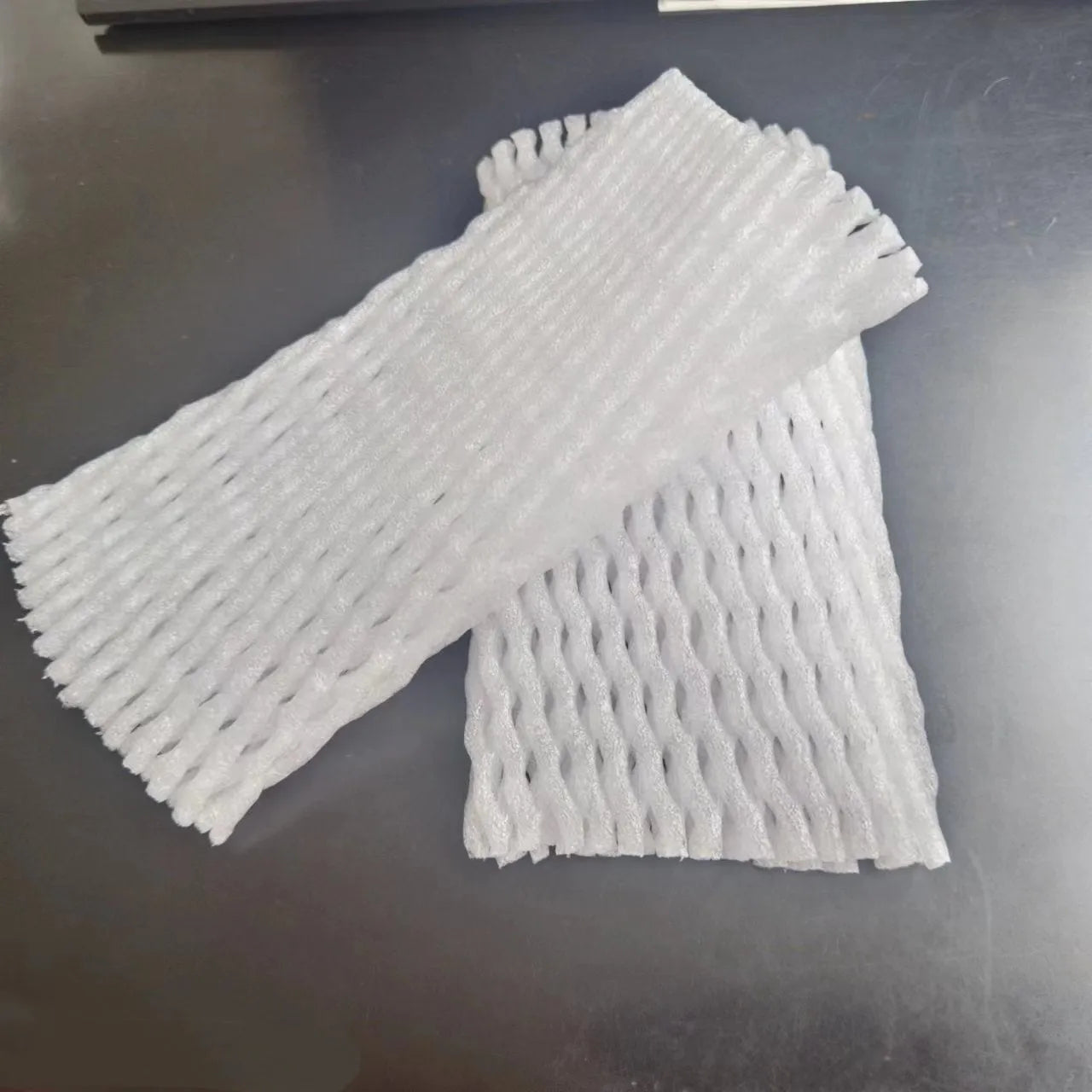White foam net shockproof protective case for fruit, shown with sizing options.