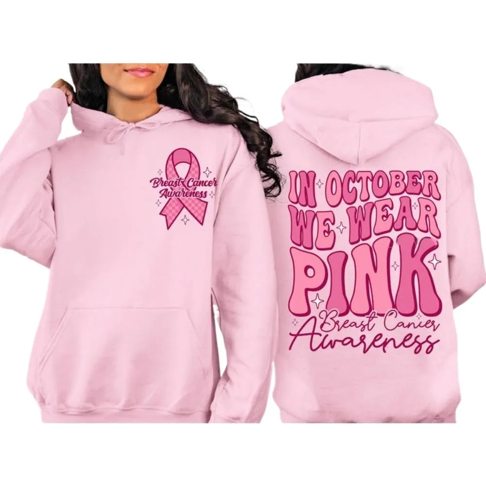Women's pink breast cancer awareness pullover hoodie with a retro graphic design and side seam pockets.