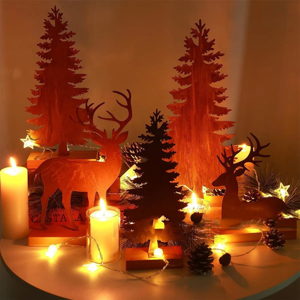 Three iron Christmas tree ornaments with elk designs in rustic finish