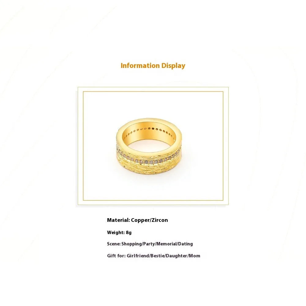 Gold geometric zircon ring in electroplated copper showing angular design details