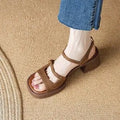 Women's open toe square toe retro platform sandals in milky white colour on a neutral background.